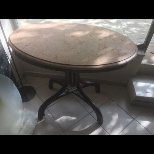 Vintage table with bent wood and oval salmon-pink marble used