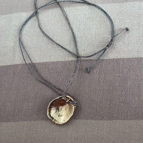 Long cord necklace adjustable, like new, metallic gold color