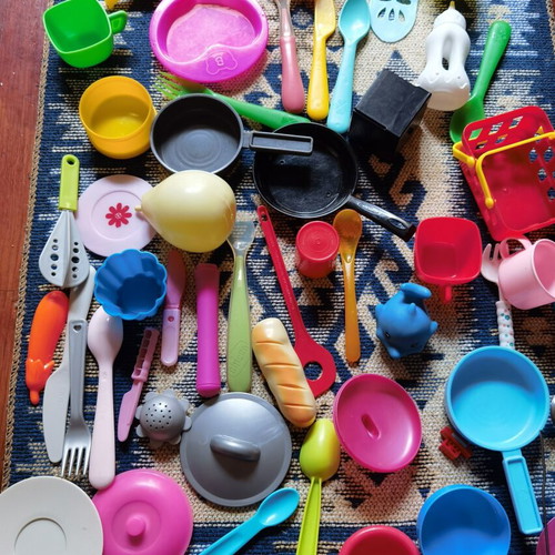 Large set of children's kitchen utensils and plastic food toys used