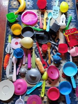 Large set of children's kitchen utensils and plastic food toys used