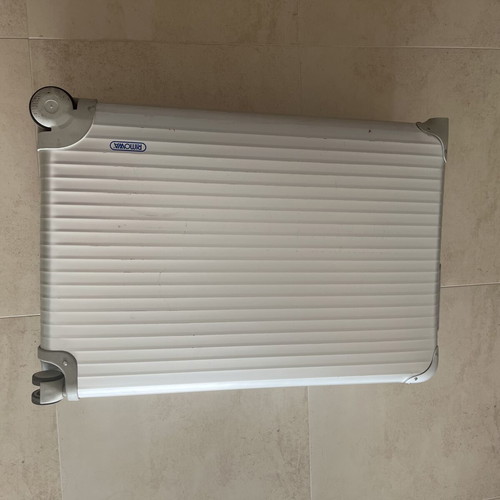 Rimowa travel bag used, silver color, slight defect