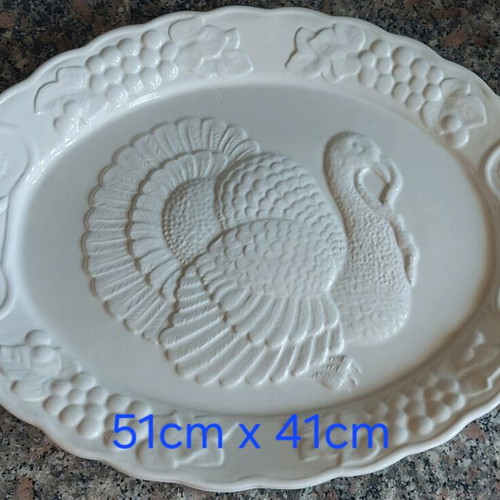 Large ceramic oval platter with embossed design like new
