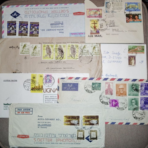 Collection of envelopes and stamps from around the world, new