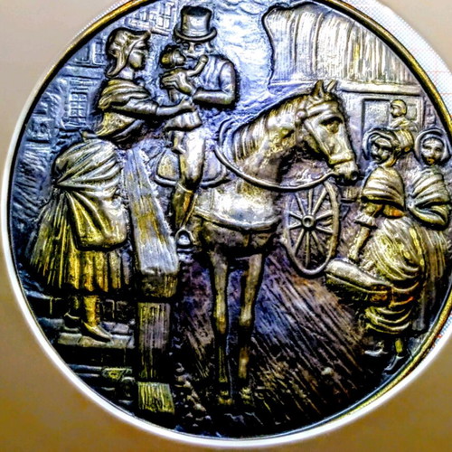 Vintage round brass plate used with embossed scene