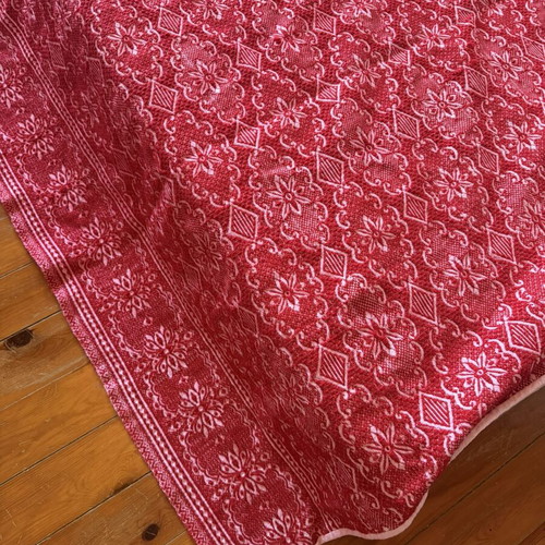 Vintage red wool blanket with geometric and floral patterns