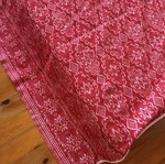 Vintage red wool blanket with geometric and floral patterns