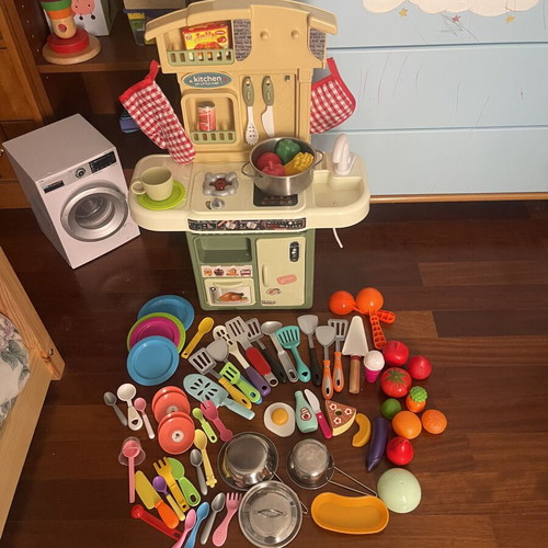 Children's play kitchen with many accessories