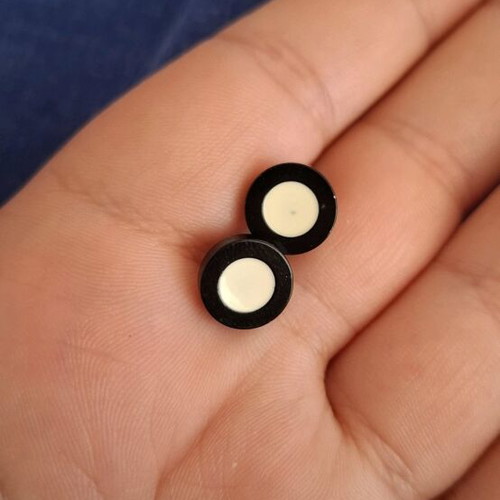 Barbell piercing earrings used, black and white, bar style