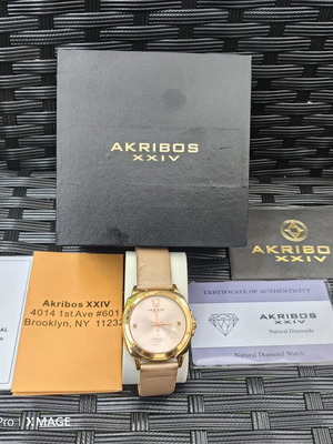 Akribos XXIV watch with diamonds used, quartz, champagne dial