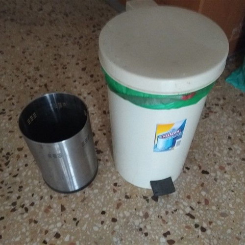 Two trash bins used, metal and plastic with pedal