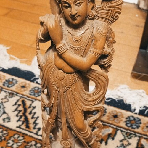 Handmade Indian wooden Krishna statue playing flute on lotus base