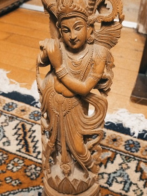 Handmade Indian wooden Krishna statue playing flute on lotus base