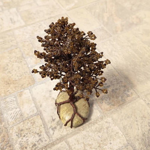 Handmade decorative tree with copper wire and beads on stone base