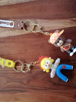 Keychains bear and girl like new, set of 2 multicolored