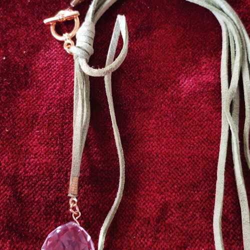 Asymmetric long necklace with green suede cord, crystal & CC motif used