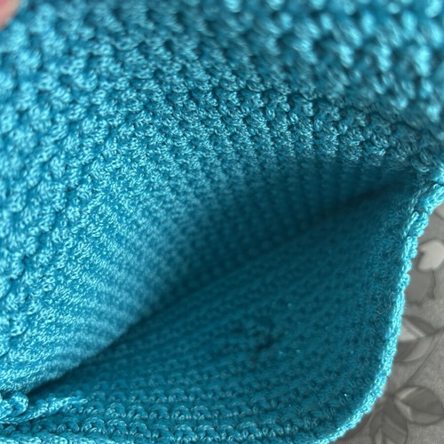 Handmade knitted clutch bag blue with button closure