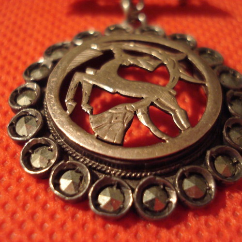 Silver brooch with 9k gold used