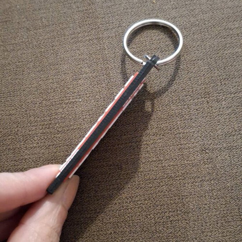 Marvel keychain like new, black/red/white rubber