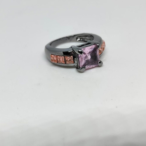 Ring with purple central crystal and pink details in black metal like new