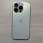 iPhone 14 Pro 128GB used, gold, with two cases, minor back crack
