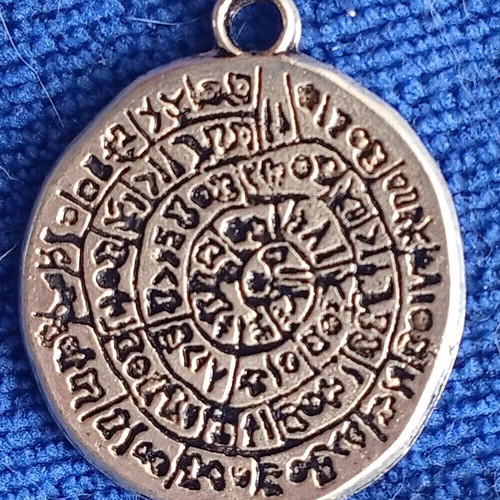 Pendant with Phaistos Disc design, like new, silver plated metal
