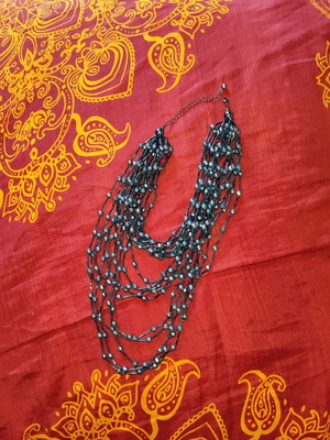 Long necklace with 18 rows of black beads like new