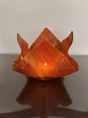 Handmade glass candlestick in red, orange and yellow shades