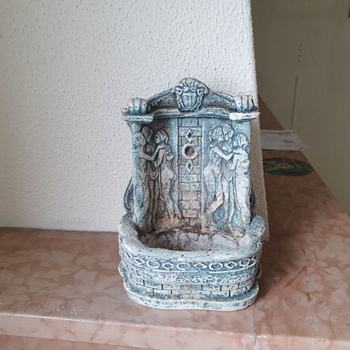 Decorative fountain spout used with embossed figures