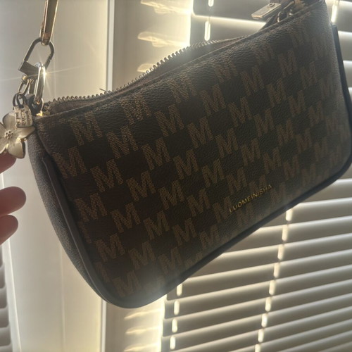 Brown crossbody bag like new with charm flower