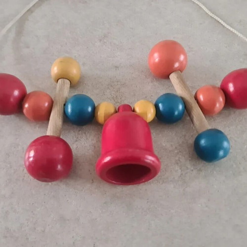 Vintage wooden stroller toy.