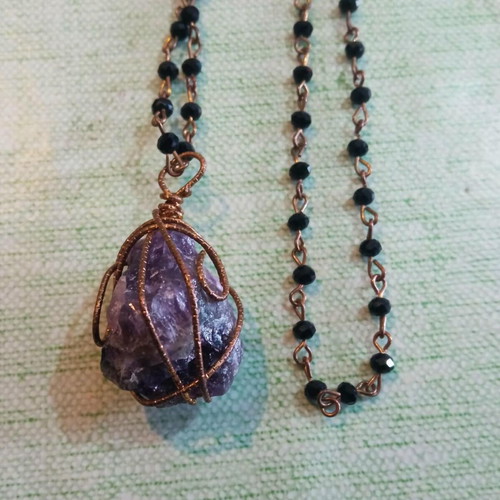 Pendant with amethyst wire-wrapped in copper and long rosary chain like new