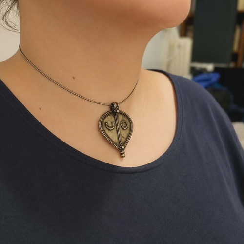 Vintage necklace with 925 silver chain and large ethnic pendant used