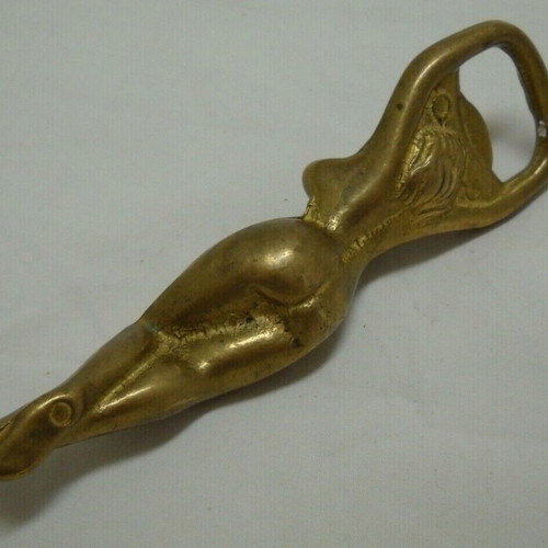 Vintage solid brass bottle opener shaped like a woman used