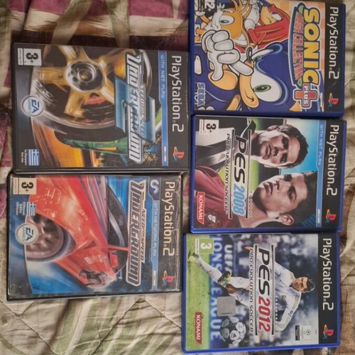 Sony PlayStation 2 console with 2 controllers, memory card and 5 games