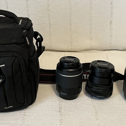 Pentax K-70 SLR digital camera with two lenses and accessories
