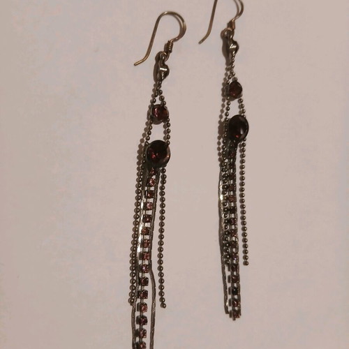 Dangling earrings with purple stones used
