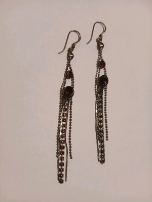 Dangling earrings with purple stones used
