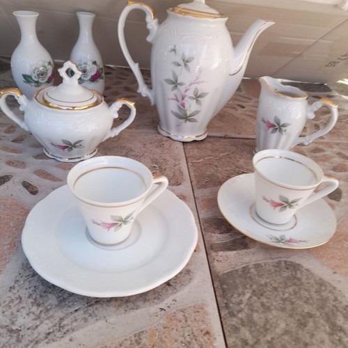 Porcelain tea set collectible with gold details and small vases like new
