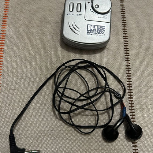 Pocket Radio with Headphones like new, silver color