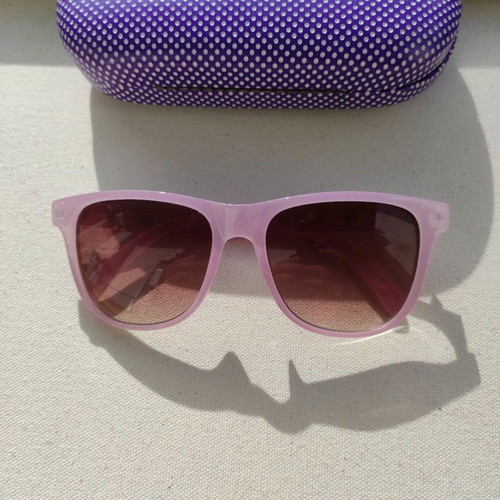 Purple sunglasses used with case