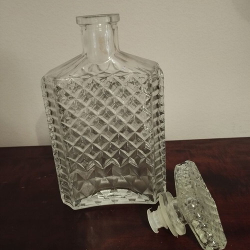 Glass whiskey bottle with embossed design and square stopper, 1980s