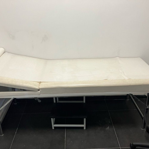Folding examination bed for aesthetic treatments and massage