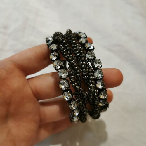 Bracelet used with strass and braided chain detail