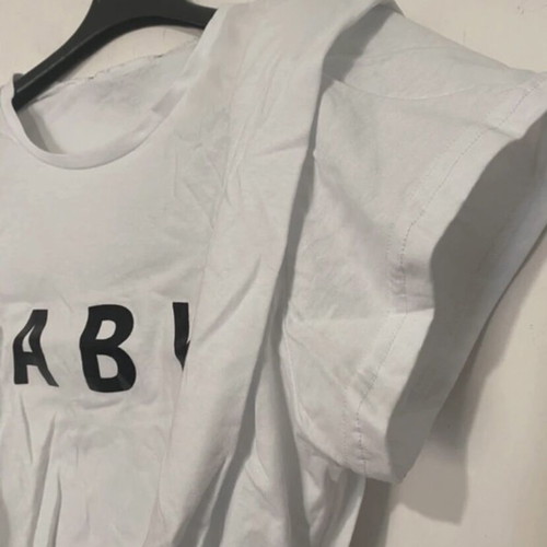 Crop top white with black print, shoulder pads and pleats, new