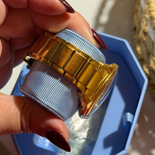 Vogue watch used, gold color with scratches