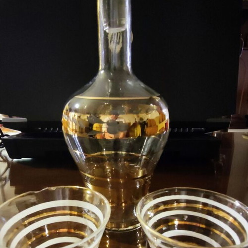 Vintage glass decanter set with 2 glasses used, gold decorations