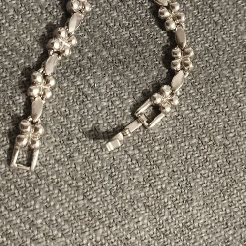 Riviera necklace with flower and four-leaf motifs, silver