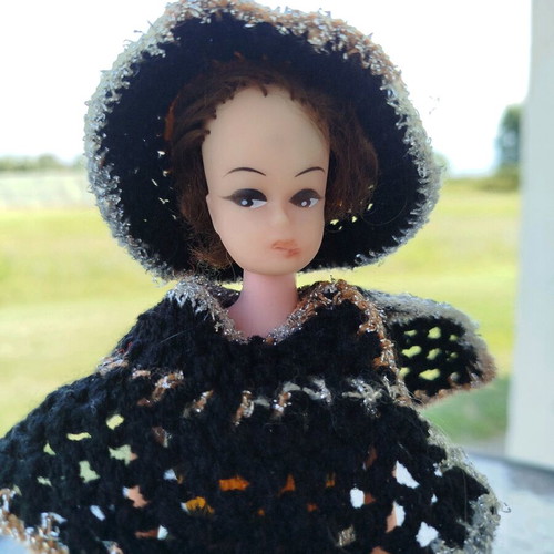 70s doll with handmade knitted clothes and metal stand