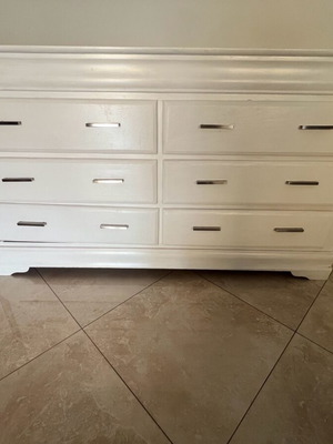 White furniture used with cabinet needing repair