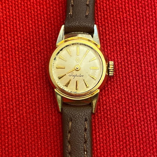 Wristwatch women's used, wind-up, metal, gold color, 1960s era